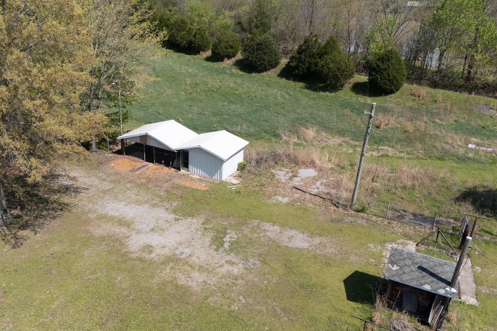 13849 Mustang Road Marion, IL 62959 - Photo 9 of 13 a wooden bench sitting in the middle of a yard