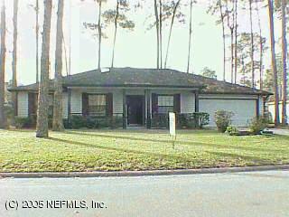 11084 Reading Road Jacksonville, FL 32257 - Photo 1 of 1 a house that has a tree in front of it