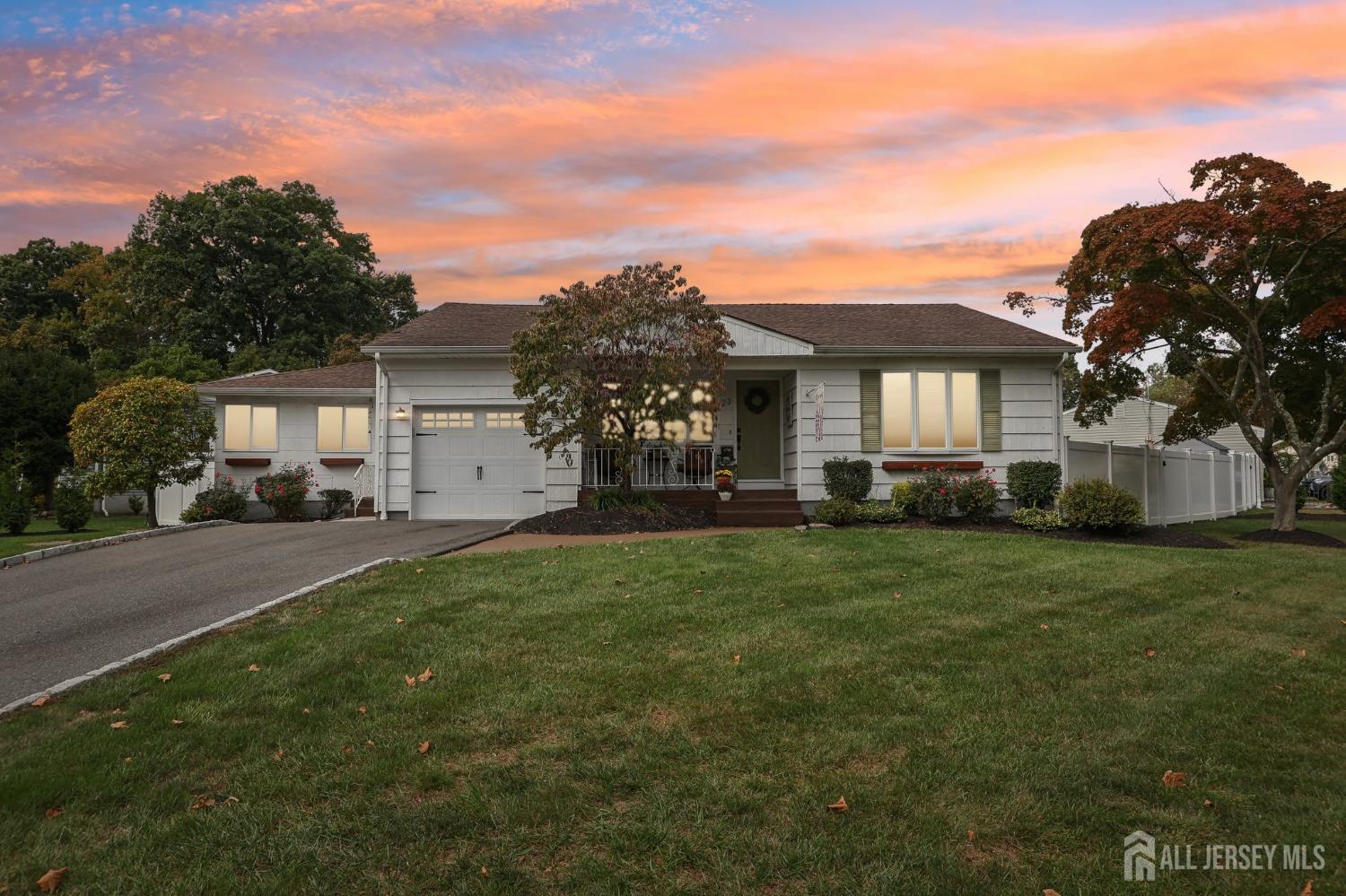 23 Brox Road Edison, NJ 08817 - Photo 1 of 33 a front view of a house with a garden