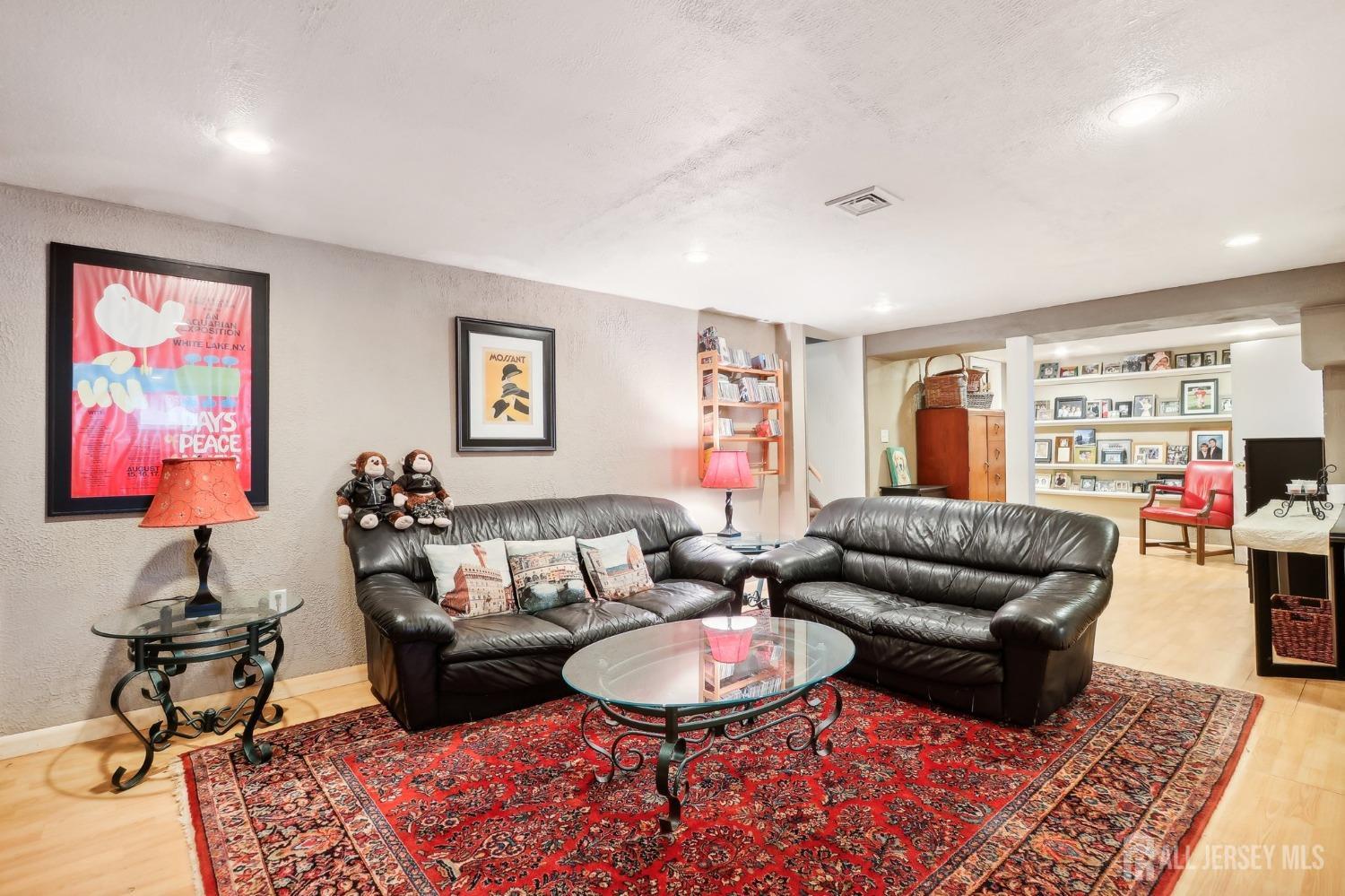 23 Brox Road Edison, NJ 08817 - Photo 15 of 33 a living room with furniture a rug and a window