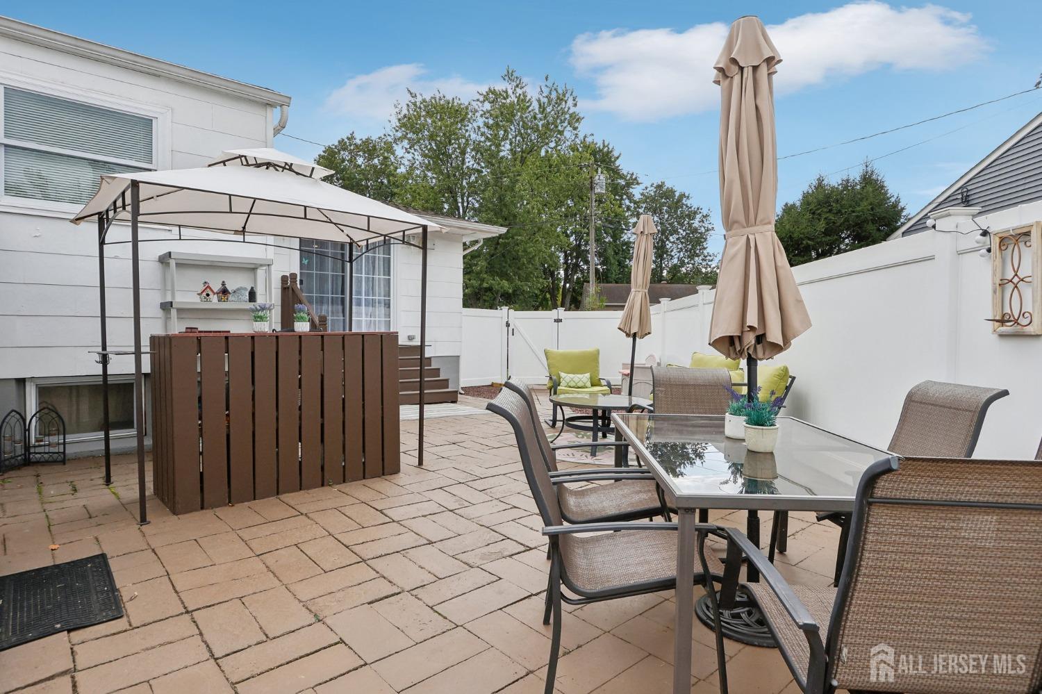 23 Brox Road Edison, NJ 08817 - Photo 22 of 33 a view of a patio with a table and chairs