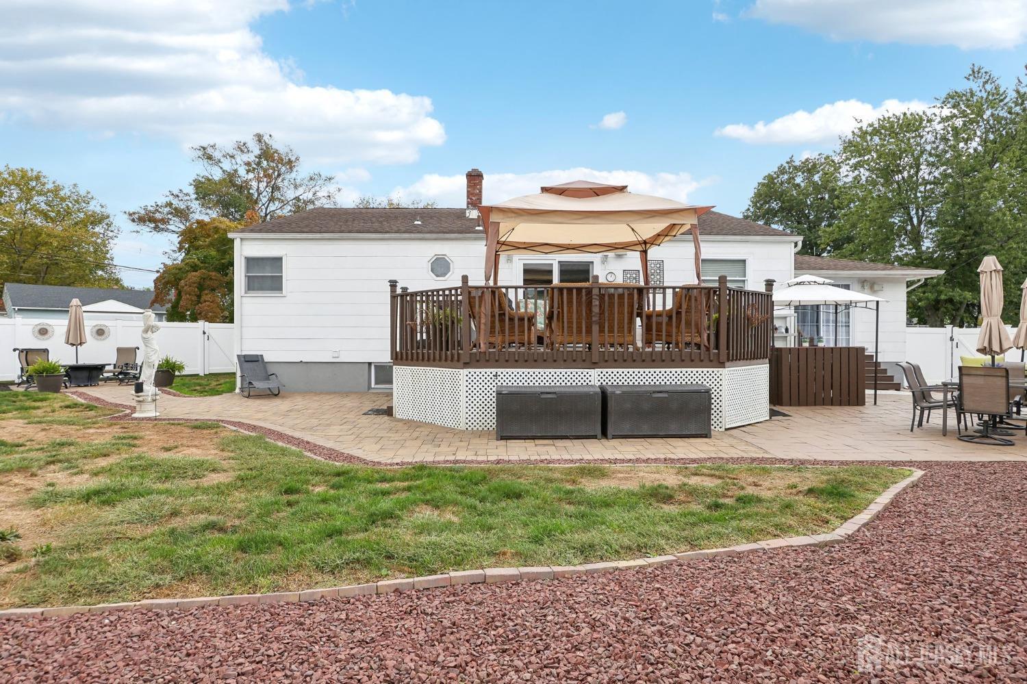 23 Brox Road Edison, NJ 08817 - Photo 29 of 33 a view of a house with backyard and sitting area