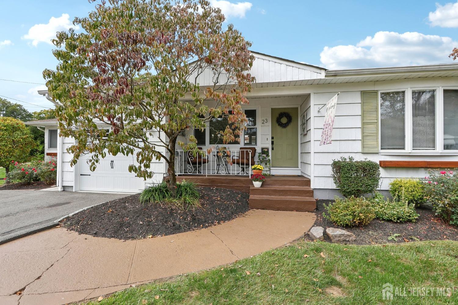 23 Brox Road Edison, NJ 08817 - Photo 3 of 33 a front view of a house with garden