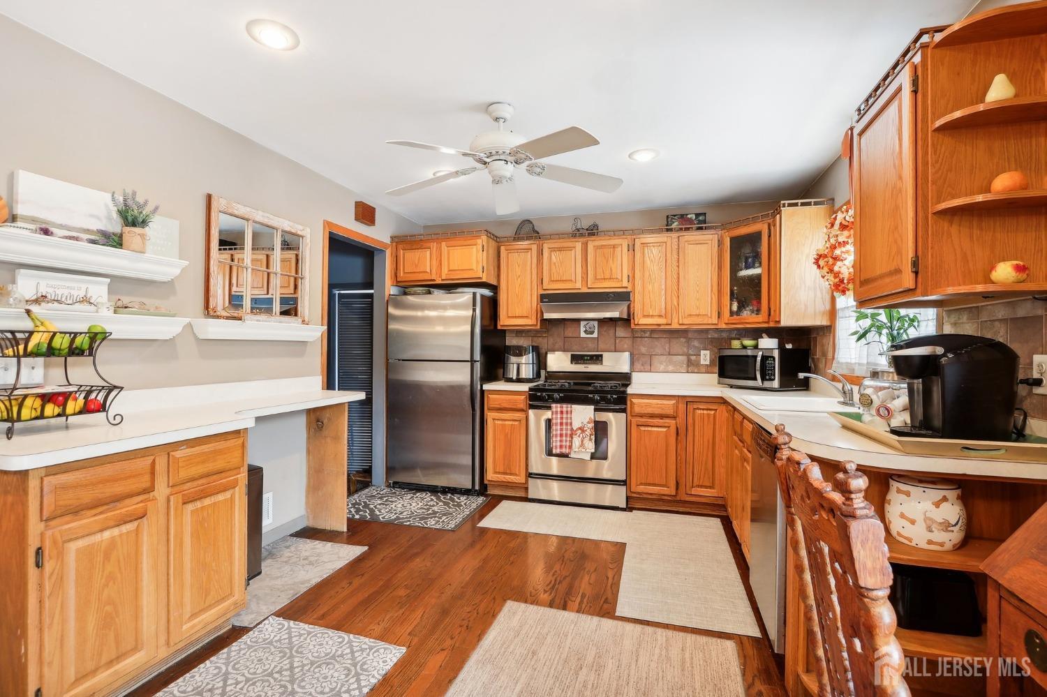 23 Brox Road Edison, NJ 08817 - Photo 8 of 33 a kitchen with stainless steel appliances granite countertop a refrigerator stove top oven and sink