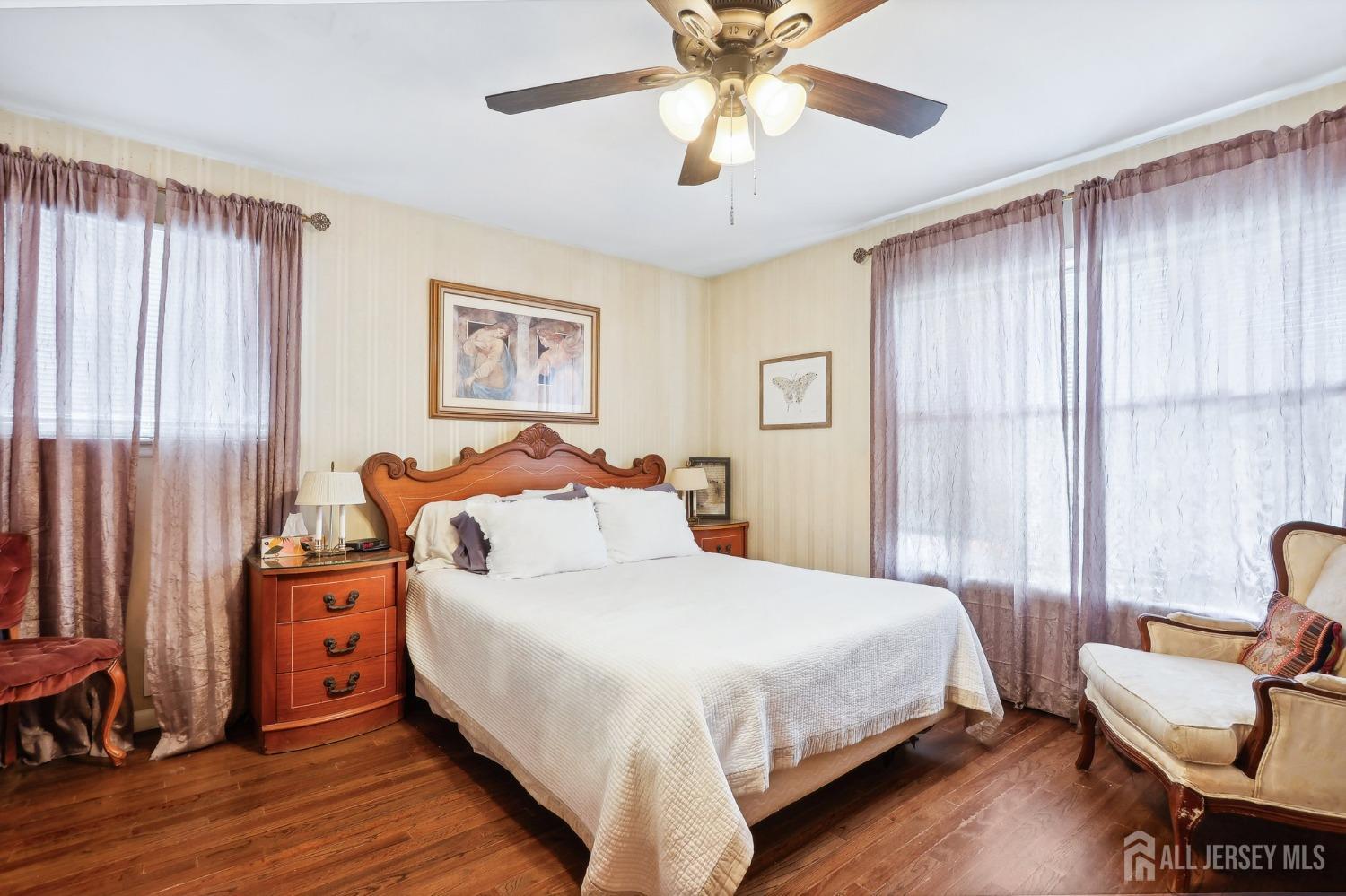 23 Brox Road Edison, NJ 08817 - Photo 10 of 33 a bedroom with a bed and a chandelier