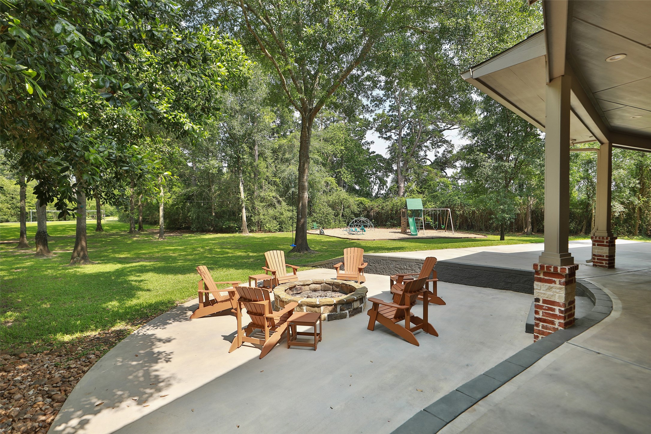 12126 Zion Road Tomball, TX 77375 - Photo 11 of 45 Spacious backyard with a cozy fire pit area at the main house. Look at the mature trees for you to watch birds, squirrels, raccoons and just listen to nature.