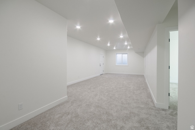 3322 250 S Street Vernal, UT 84078 - Photo 22 of 37 Spacious room featuring light gray carpeting, recessed ceiling lighting, a window with horizontal blinds, and a white interior door