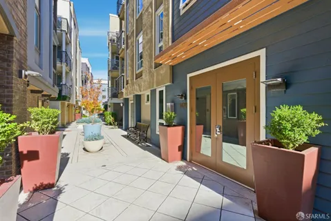 a view of a patio with couches and potted plants