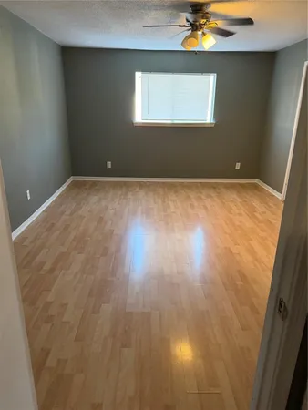 a view of room with wooden floor