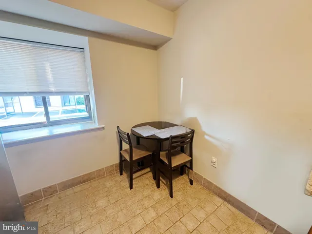 a view of a workspace with furniture