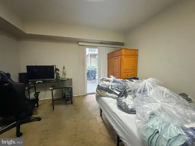 a bedroom with a bed and a television