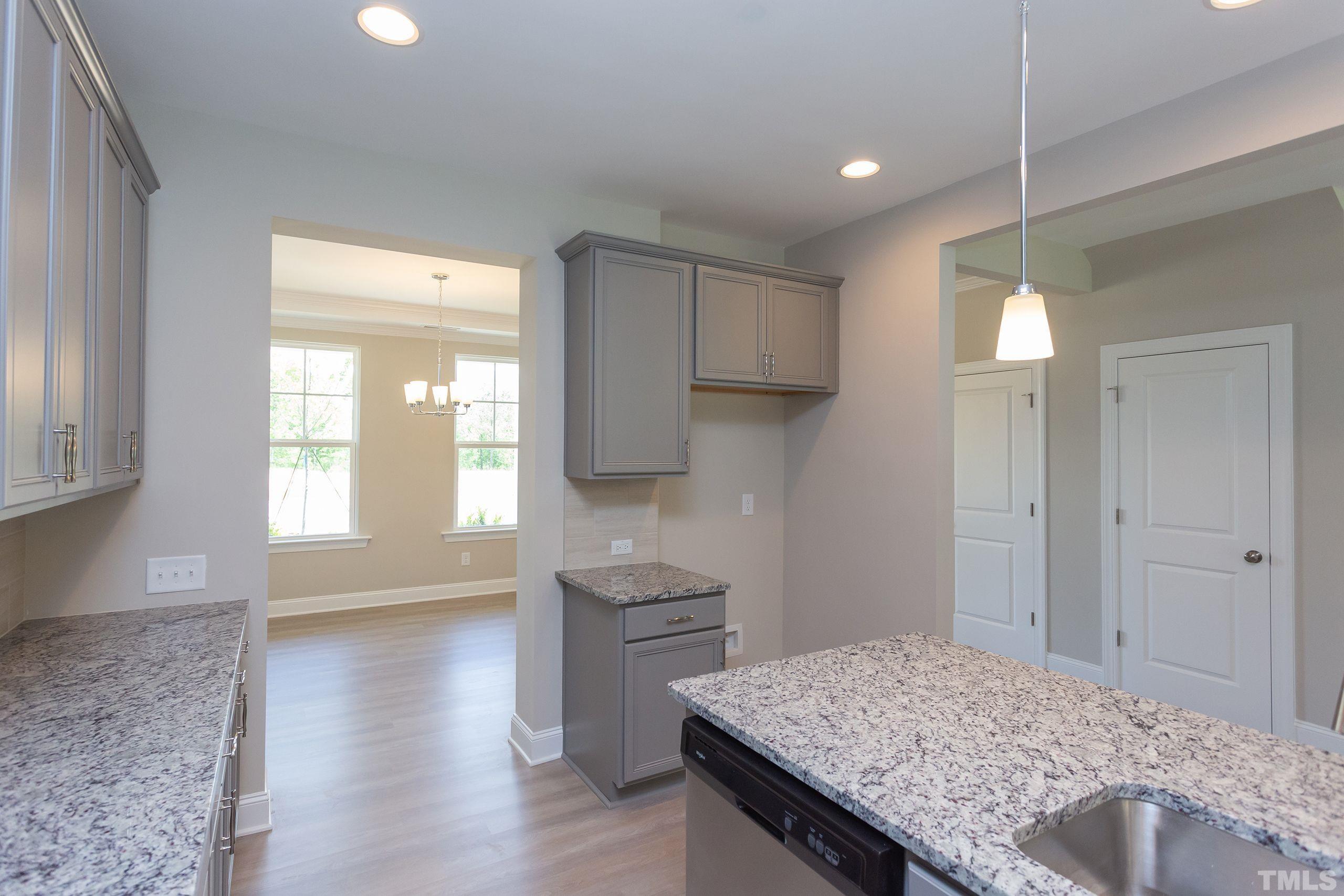 0 Pool Rock Road Henderson, NC 27536 - Photo 13 of 44 a kitchen with kitchen island a sink appliances and cabinets