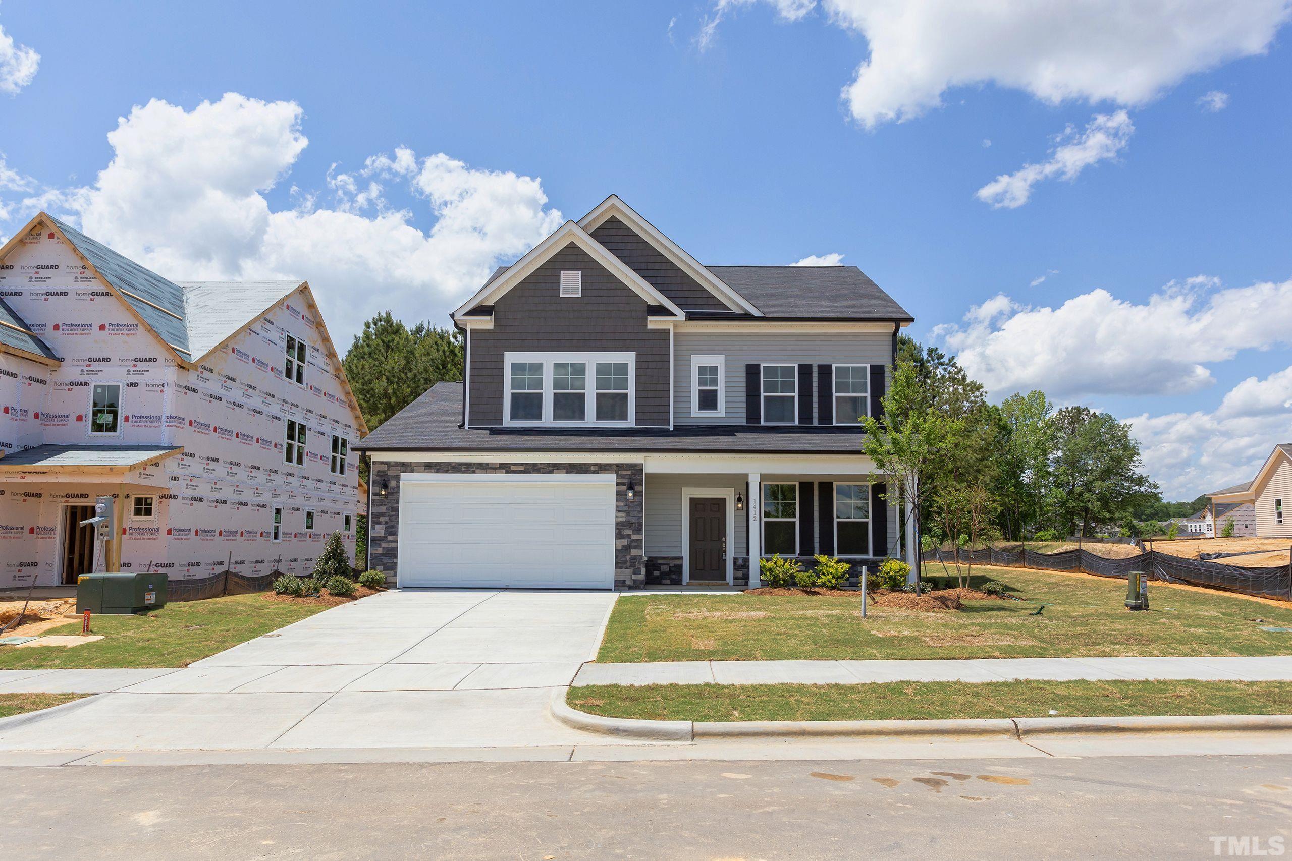 0 Pool Rock Road Henderson, NC 27536 - Photo 2 of 44 a front view of a house with a garden
