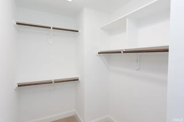 a view of a room with shelf on the wall