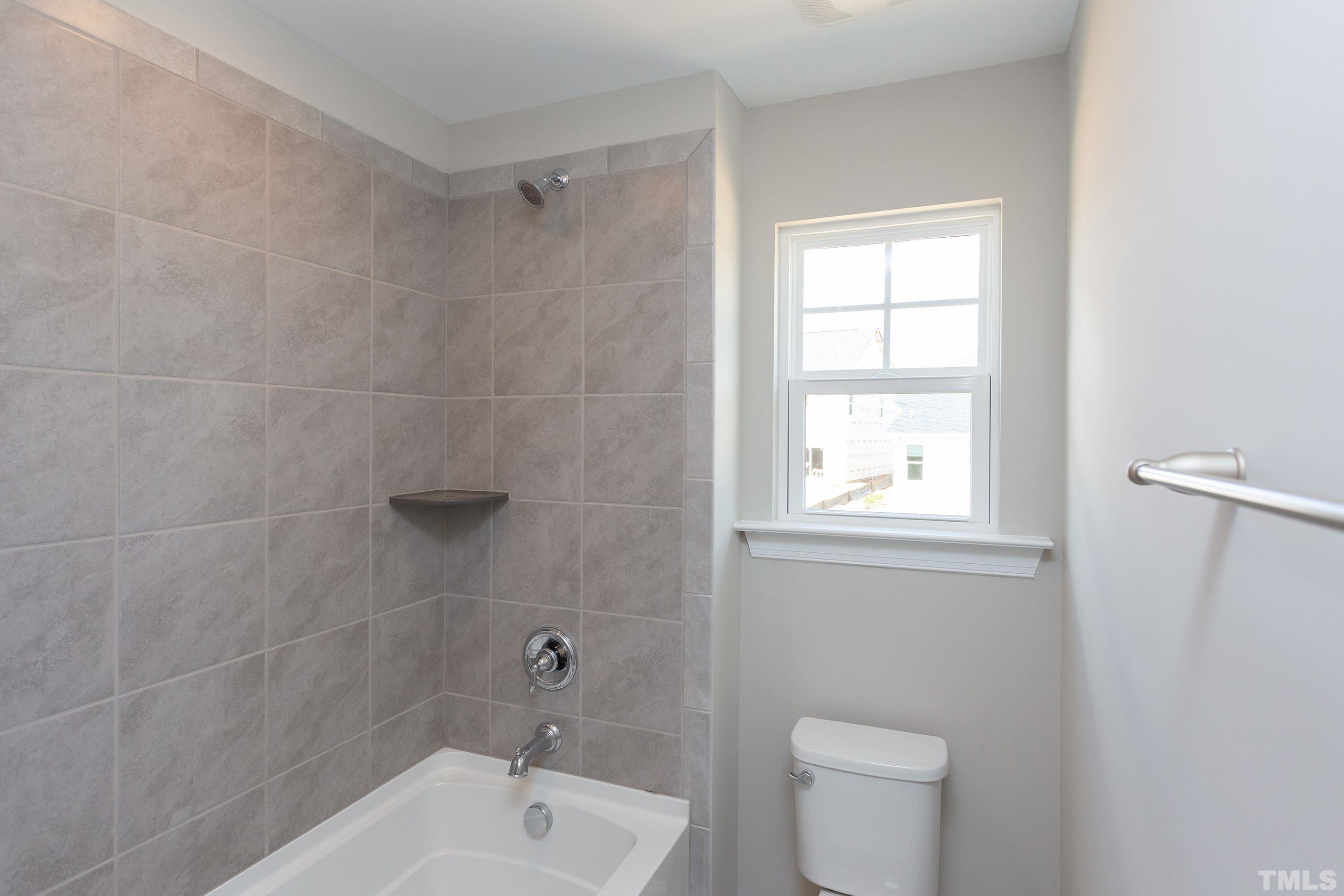 0 Pool Rock Road Henderson, NC 27536 - Photo 35 of 44 a white bath tub sitting next to a white toilet