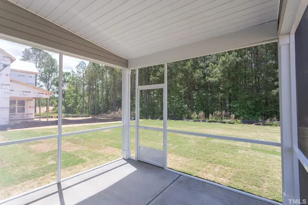 a view of an empty room with a large window