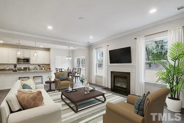 a living room with furniture fireplace and a flat screen tv