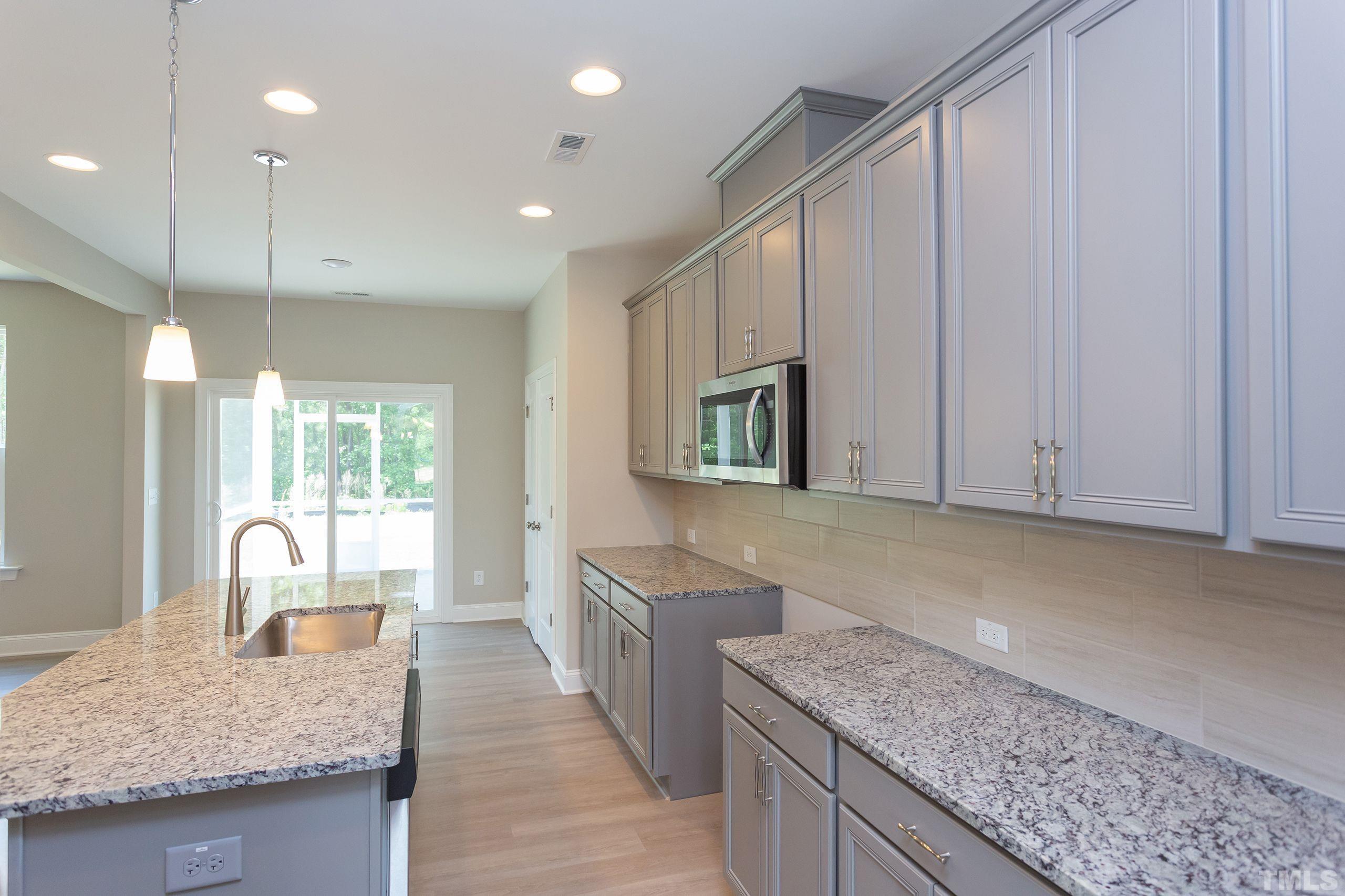 0 Pool Rock Road Henderson, NC 27536 - Photo 9 of 44 a kitchen with stainless steel appliances granite countertop a sink a oven and a refrigerator