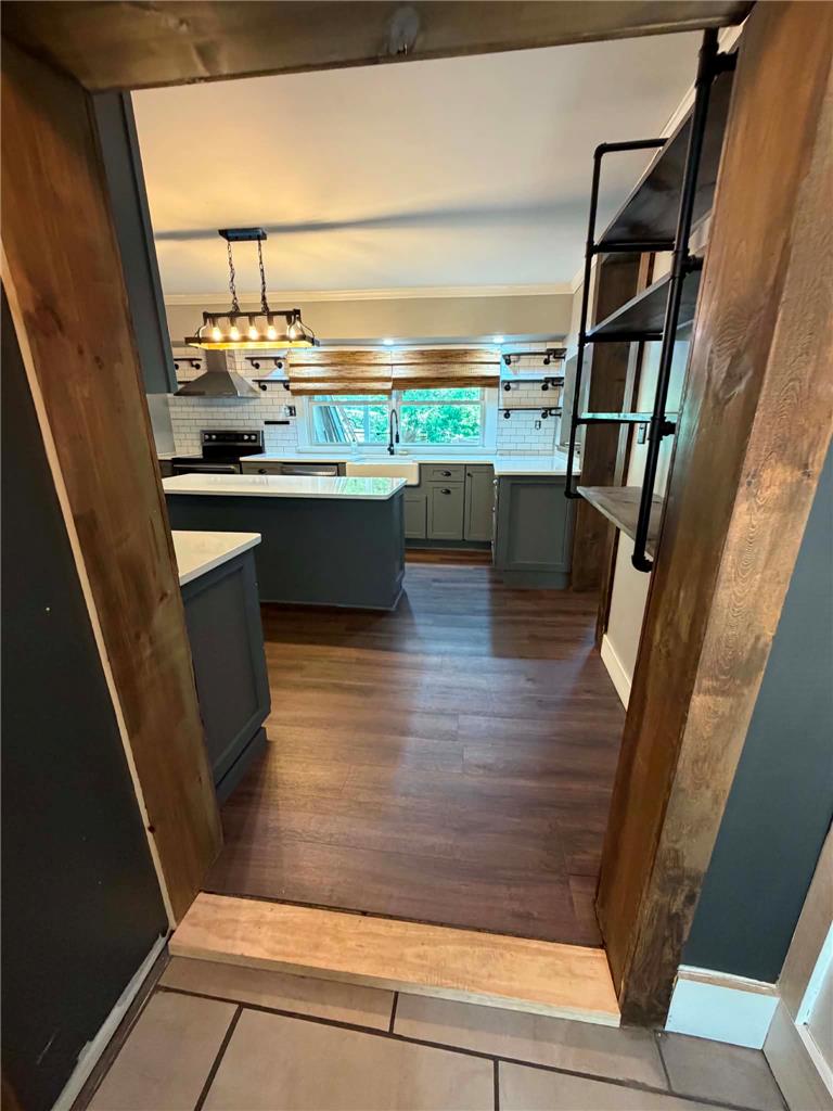 164 Sand Spring Road Cresco, PA 18326 - Photo 30 of 60 An inviting kitchen with wood flooring and an island, perfect for culinary endeavors.