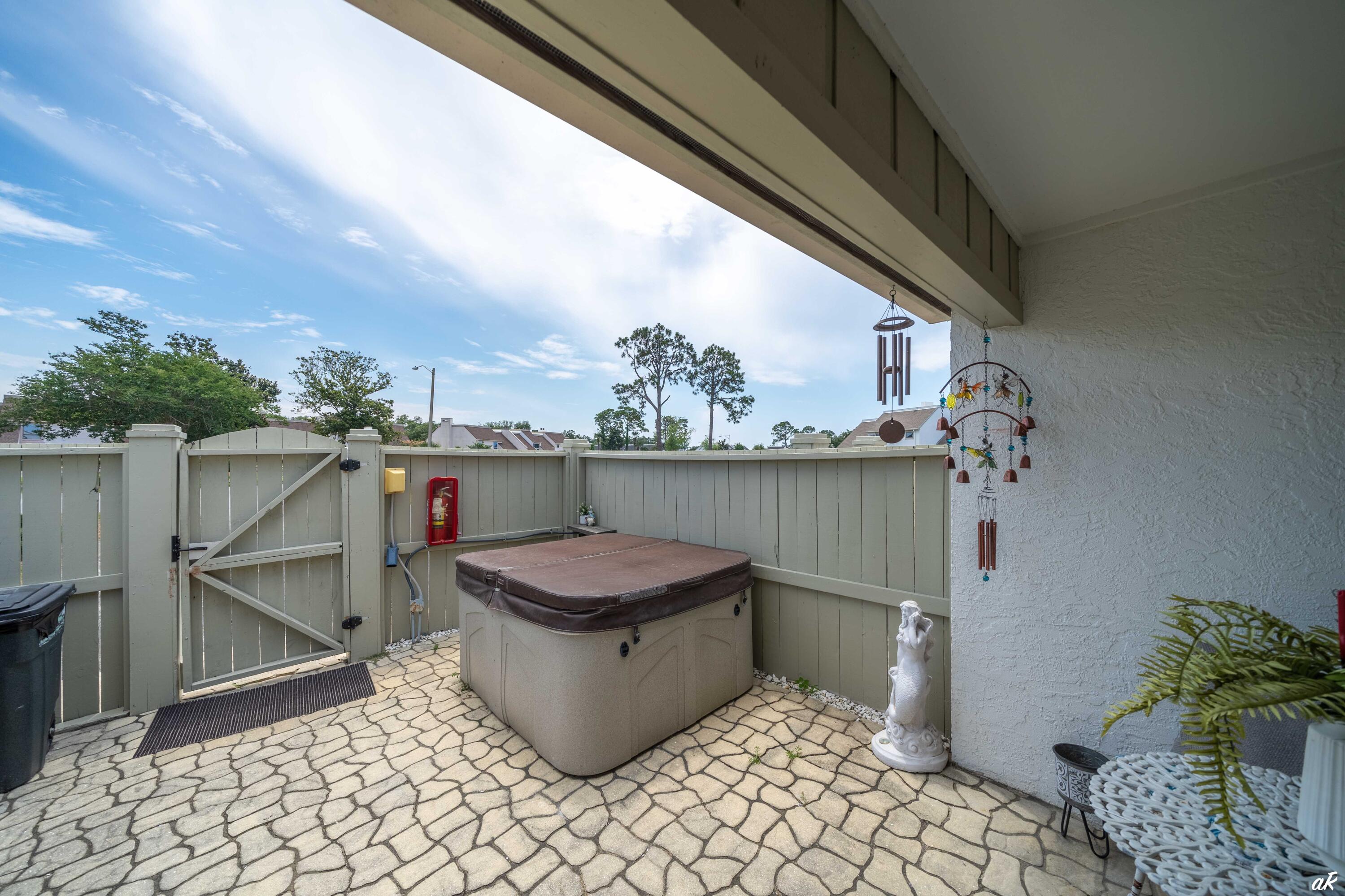 4300 Bay Point Road, Unit 417 Panama City Beach, FL 32408 - Photo 30 of 35 a view of a terrace with furniture
