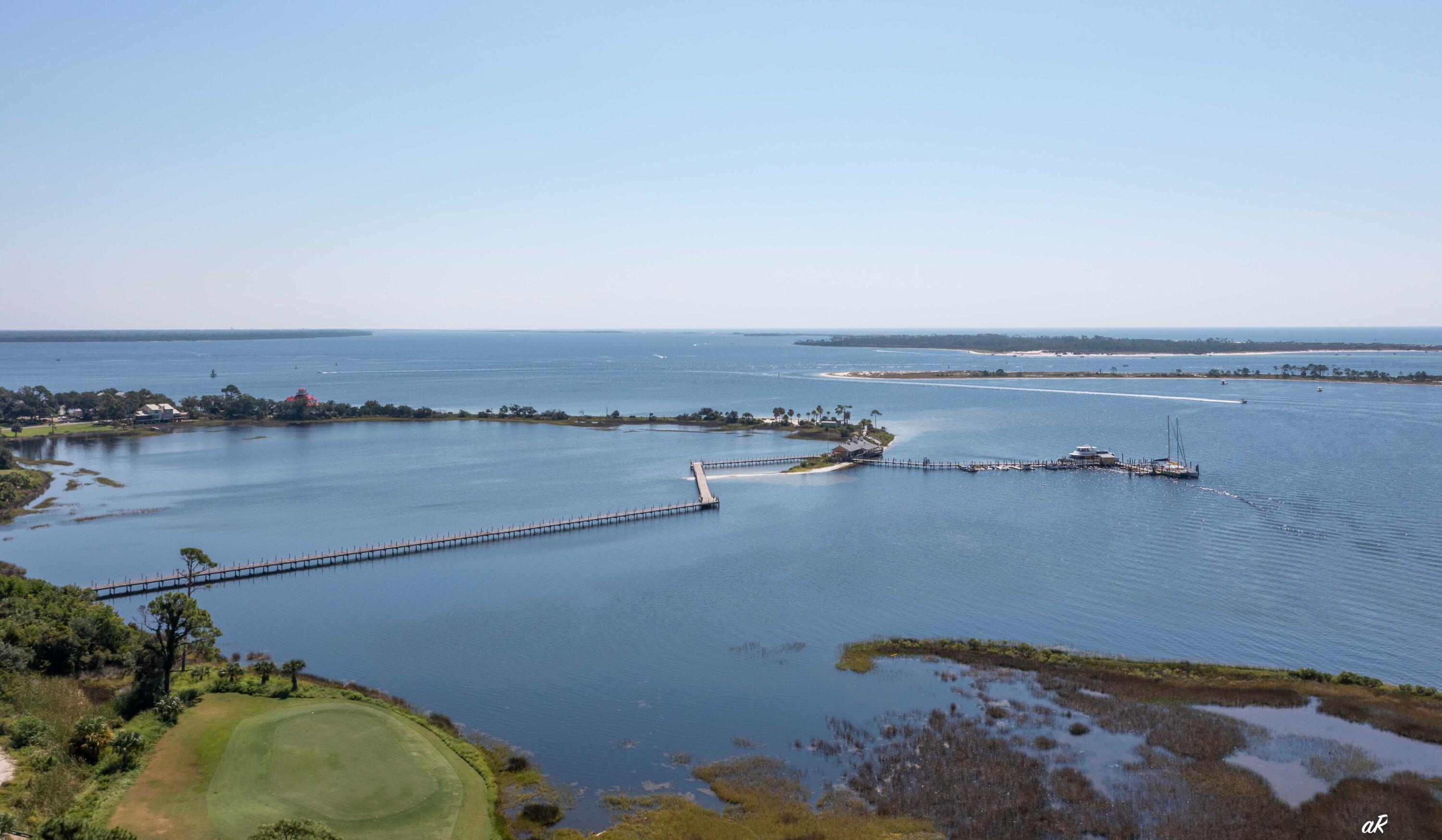 4300 Bay Point Road, Unit 417 Panama City Beach, FL 32408 - Photo 31 of 35 an aerial view of a houses with outdoor space