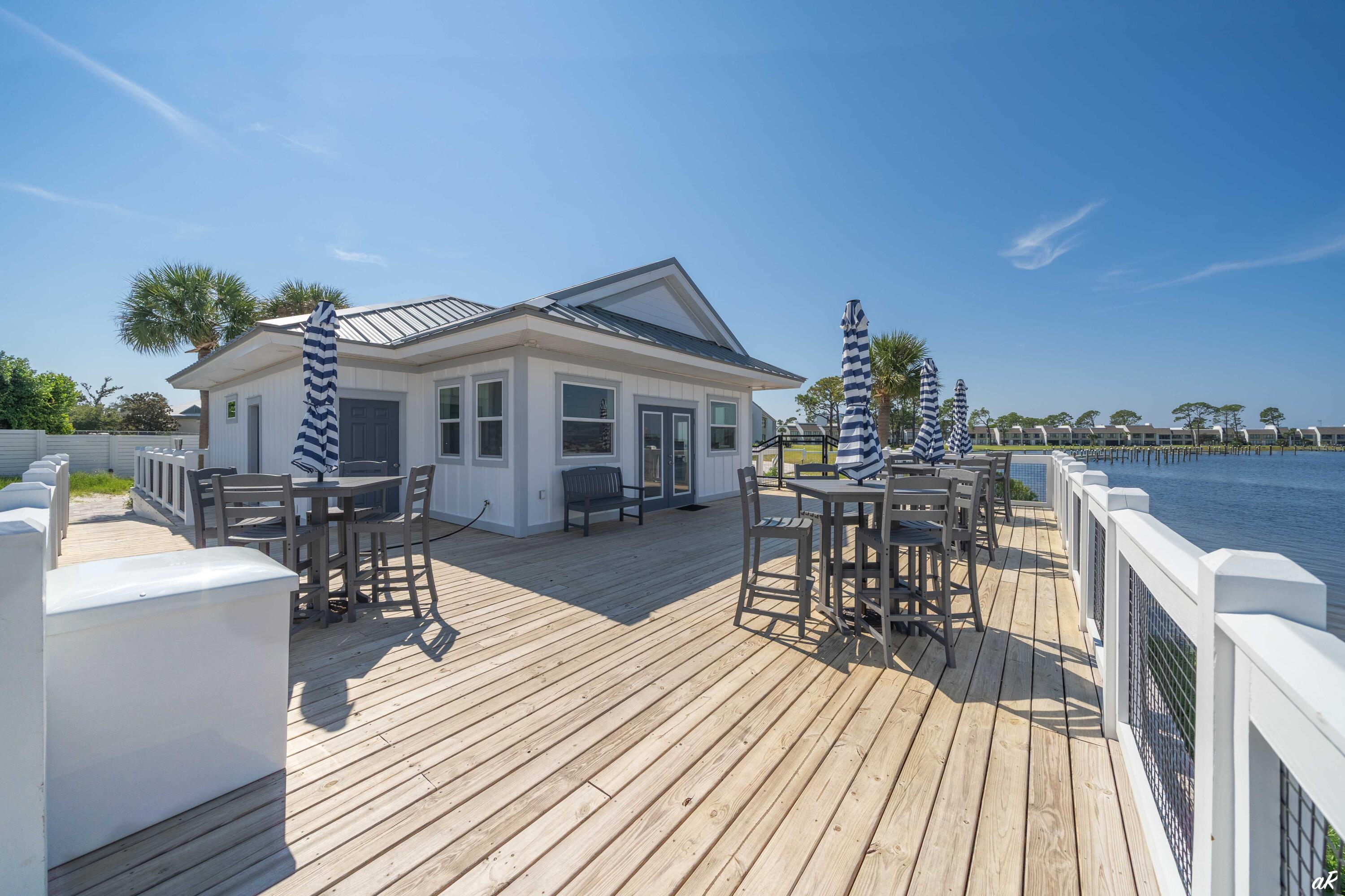 4300 Bay Point Road, Unit 417 Panama City Beach, FL 32408 - Photo 32 of 35 a view of a house with sitting area and furniture
