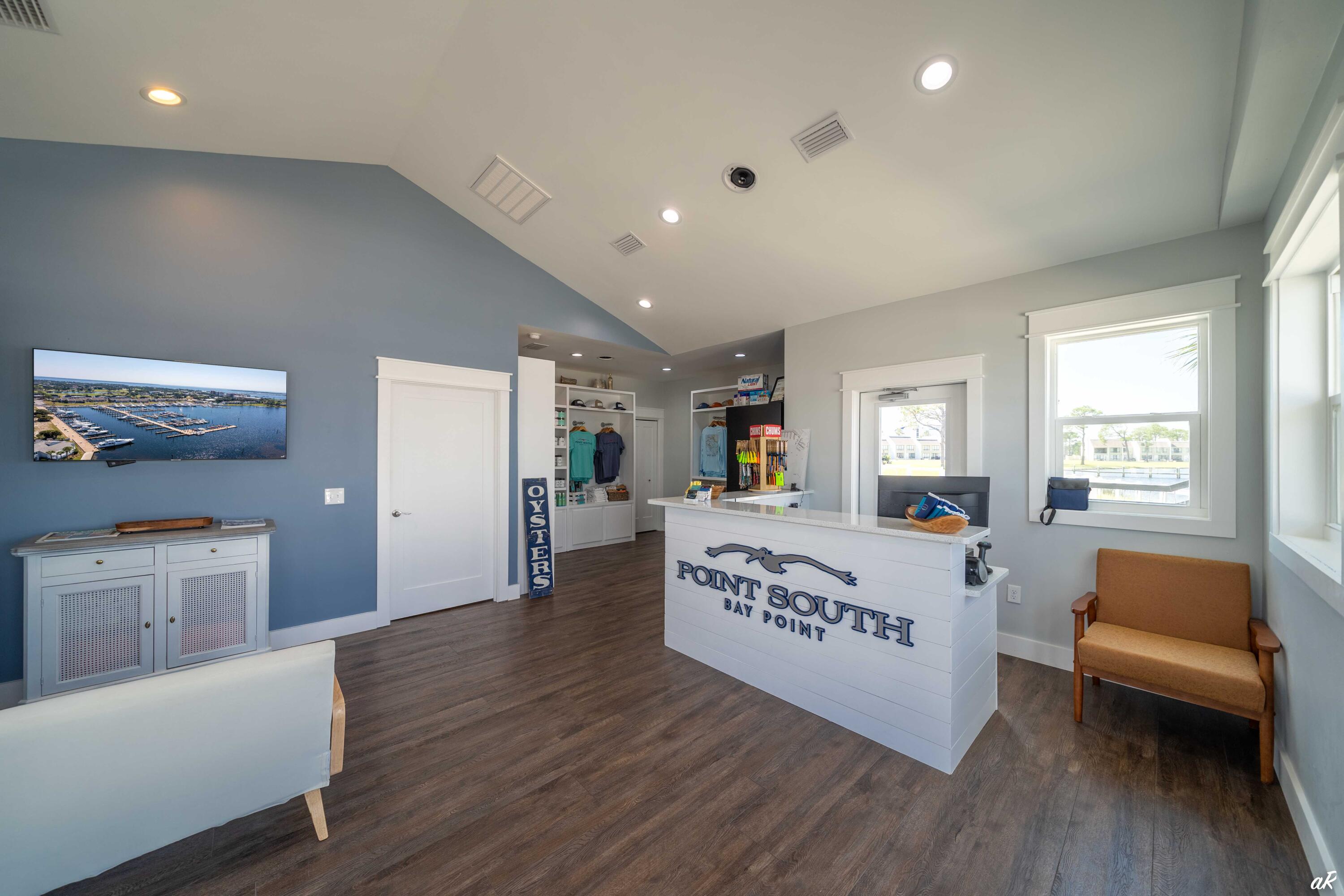 4300 Bay Point Road, Unit 417 Panama City Beach, FL 32408 - Photo 33 of 35 a living room with furniture and a wooden floor