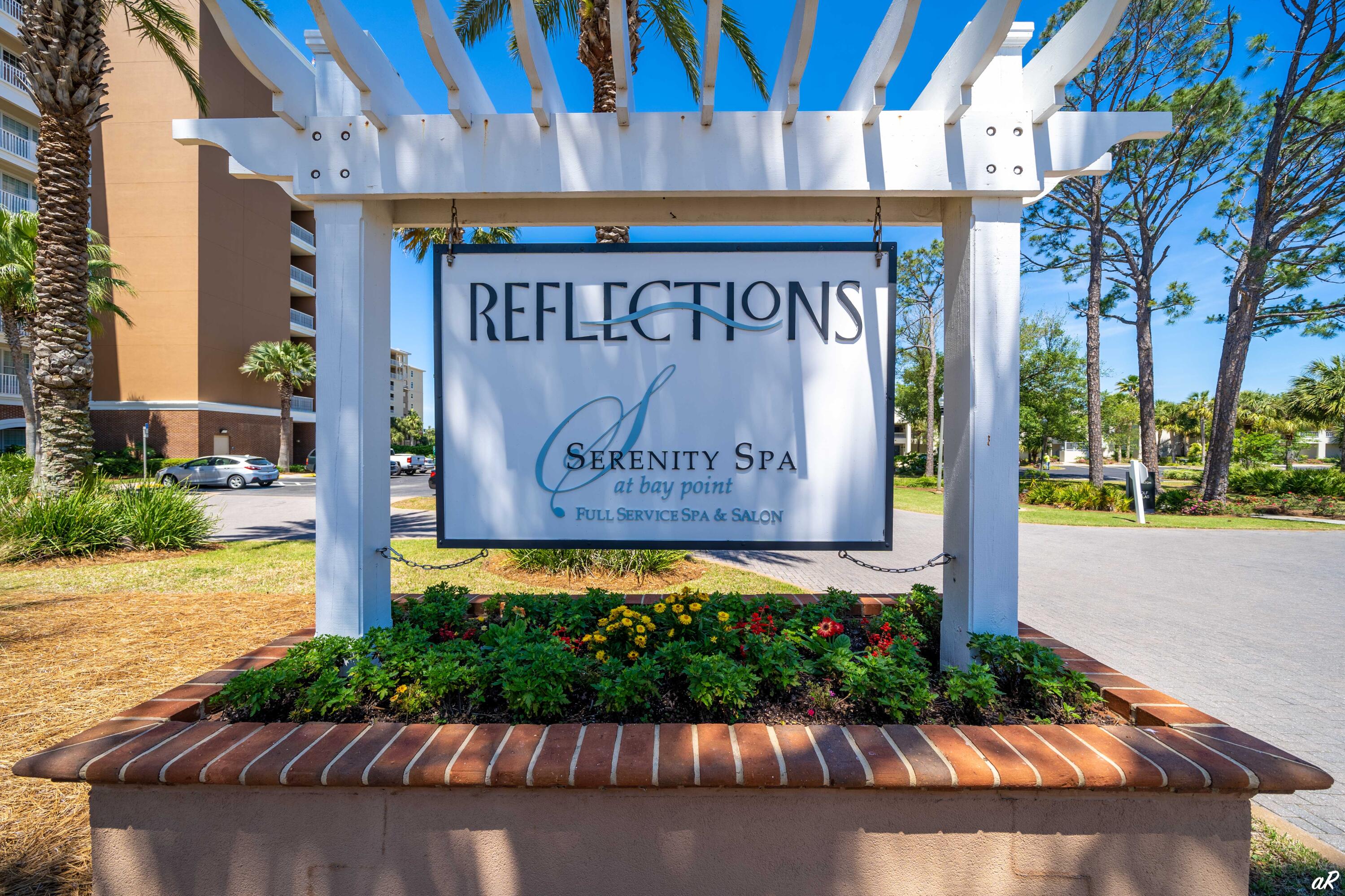 4300 Bay Point Road, Unit 417 Panama City Beach, FL 32408 - Photo 35 of 35 a sign on the side of a building