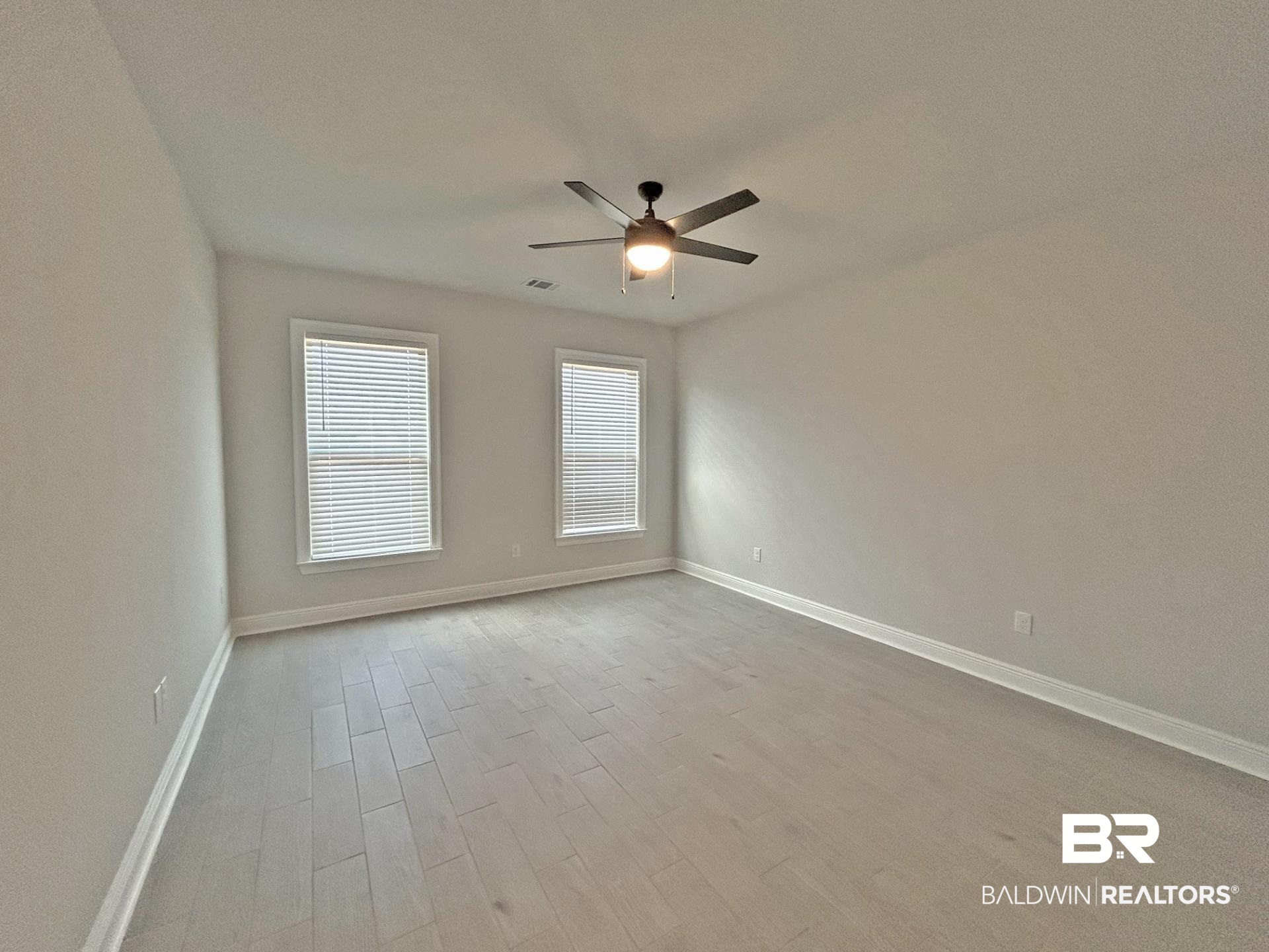 1748 Breckinridge Place Foley, AL 36535 - Photo 11 of 25 Spare room with light wood-style flooring and a ceiling fan