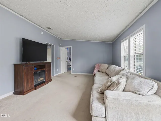 a dining room with furniture and a chandelier