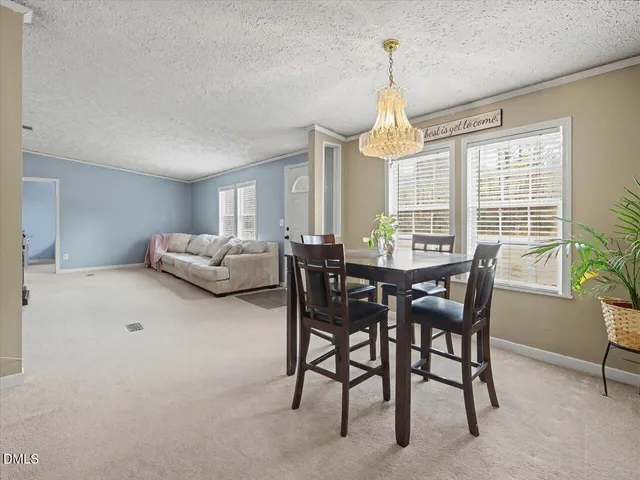 a view of livingroom with furniture fireplace fan and windows