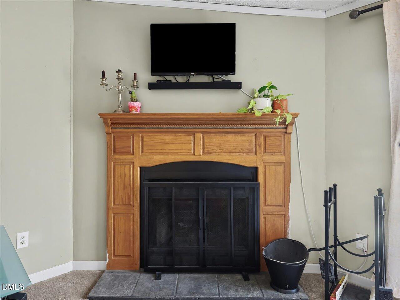 523 County Line Road Manson, NC 27553 - Photo 24 of 70 a living room with a fireplace and a flat screen tv