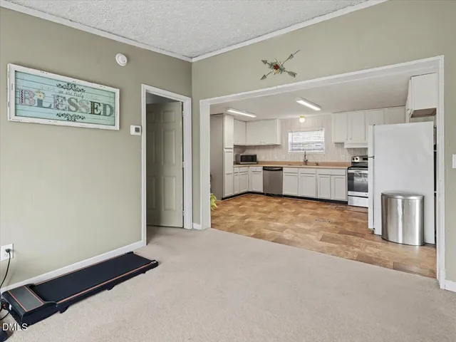 a bedroom with bed and a window