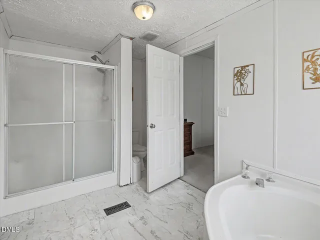 a view of a chair and table in the patio