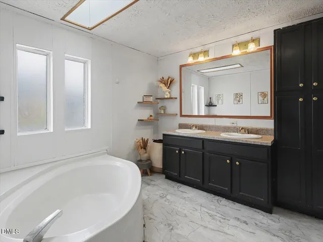 a view of a chair and table in the patio