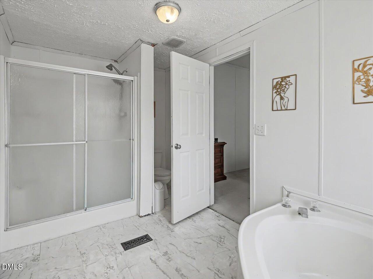 523 County Line Road Manson, NC 27553 - Photo 30 of 70 a bathroom with a bathtub and a sink