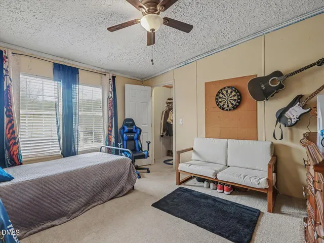 a backyard of a house with wooden fence