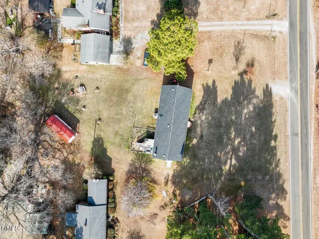 an aerial view of a houses with ocean view
