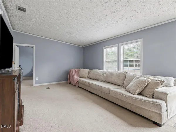 a bed room with a bed and a chandelier