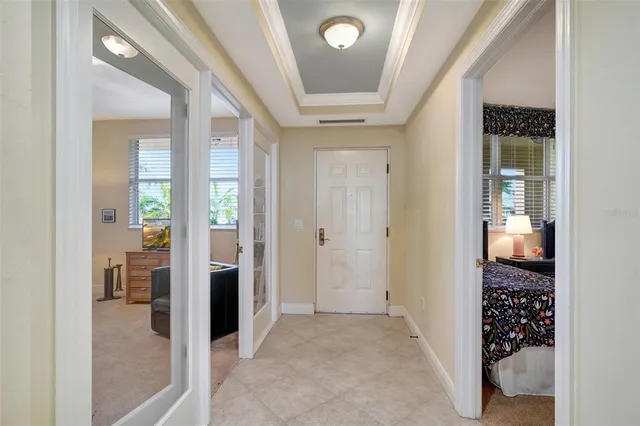 a view of a backyard with plants and a patio