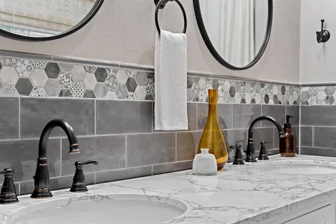 a room with a fireplace and painted walls