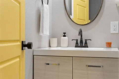 a bathroom with a sink and a mirror