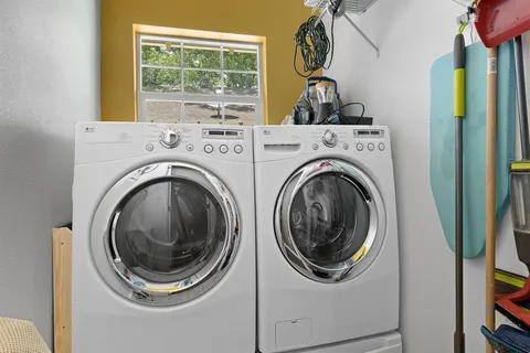 a view of a porch with furniture and front door