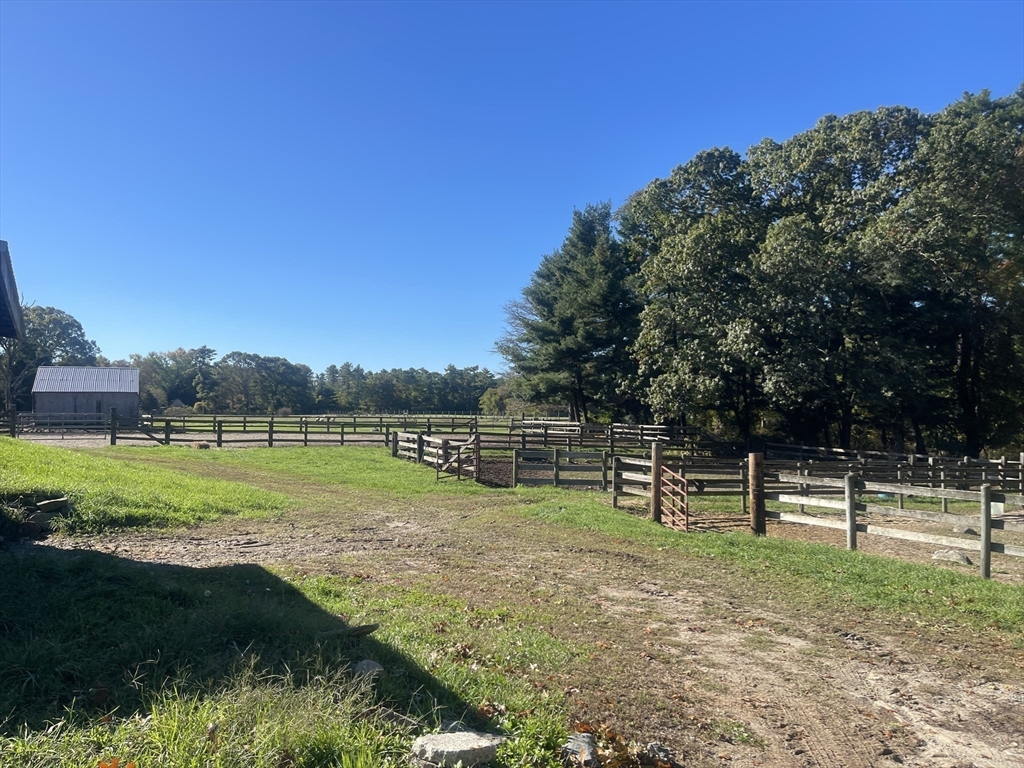 295 Cherry Street Middleboro, MA 02346 - Photo 2 of 41 a view of a park with swings and slides