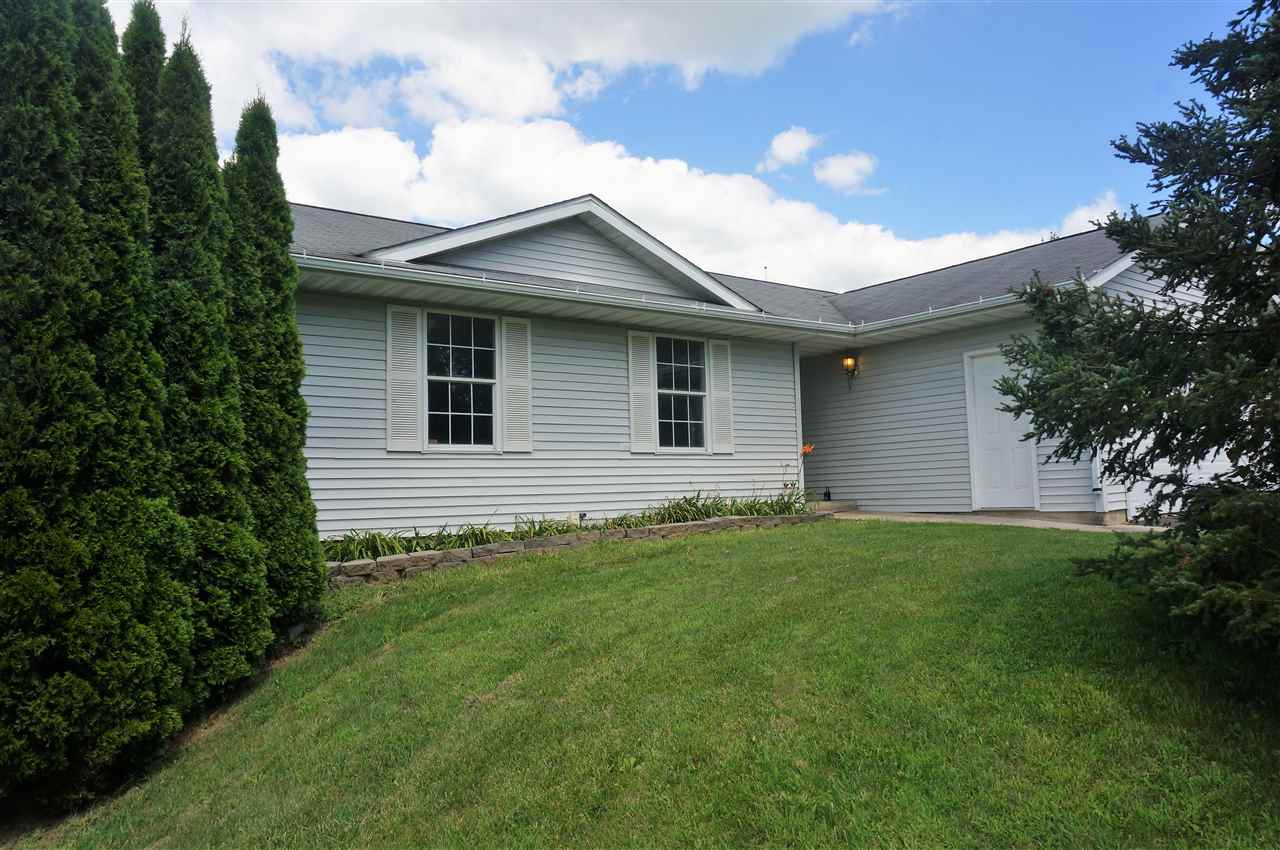 304 Rochester Road Northeast Poplar Grove, IL 61065 - Photo 2 of 23 a view of a house with a yard