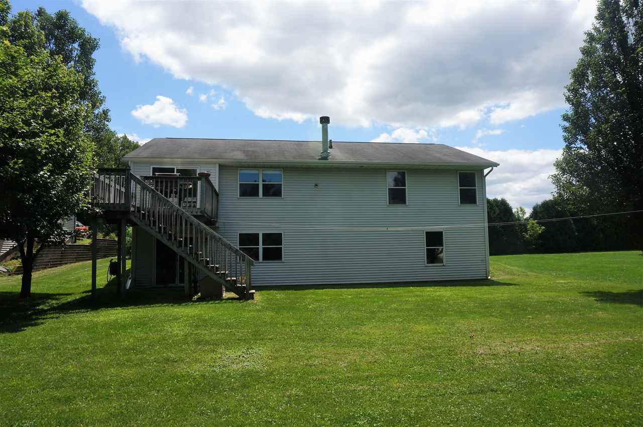 304 Rochester Road Northeast Poplar Grove, IL 61065 - Photo 21 of 23 a view of a house with backyard and garden