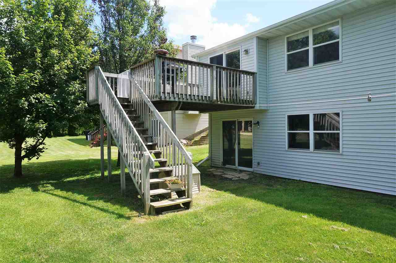 304 Rochester Road Northeast Poplar Grove, IL 61065 - Photo 22 of 23 a view of a house with a deck