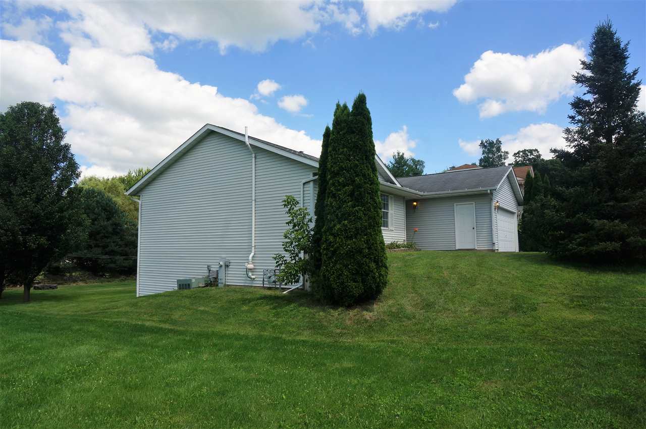 304 Rochester Road Northeast Poplar Grove, IL 61065 - Photo 3 of 23 a view of a house with a yard