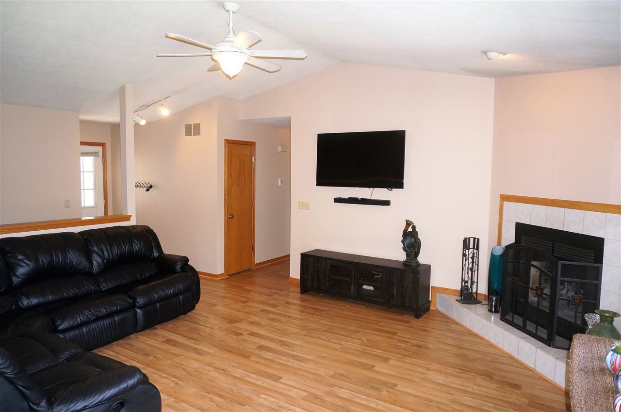 304 Rochester Road Northeast Poplar Grove, IL 61065 - Photo 7 of 23 a living room with furniture and a flat screen tv