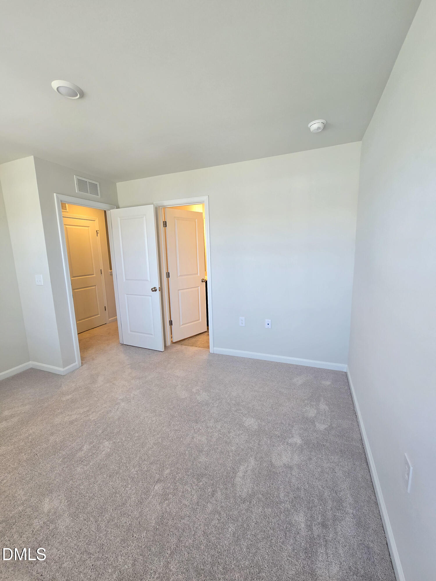 2431 Kasota Lane Raleigh, NC 27610 - Photo 39 of 46 an empty room with closet and windows
